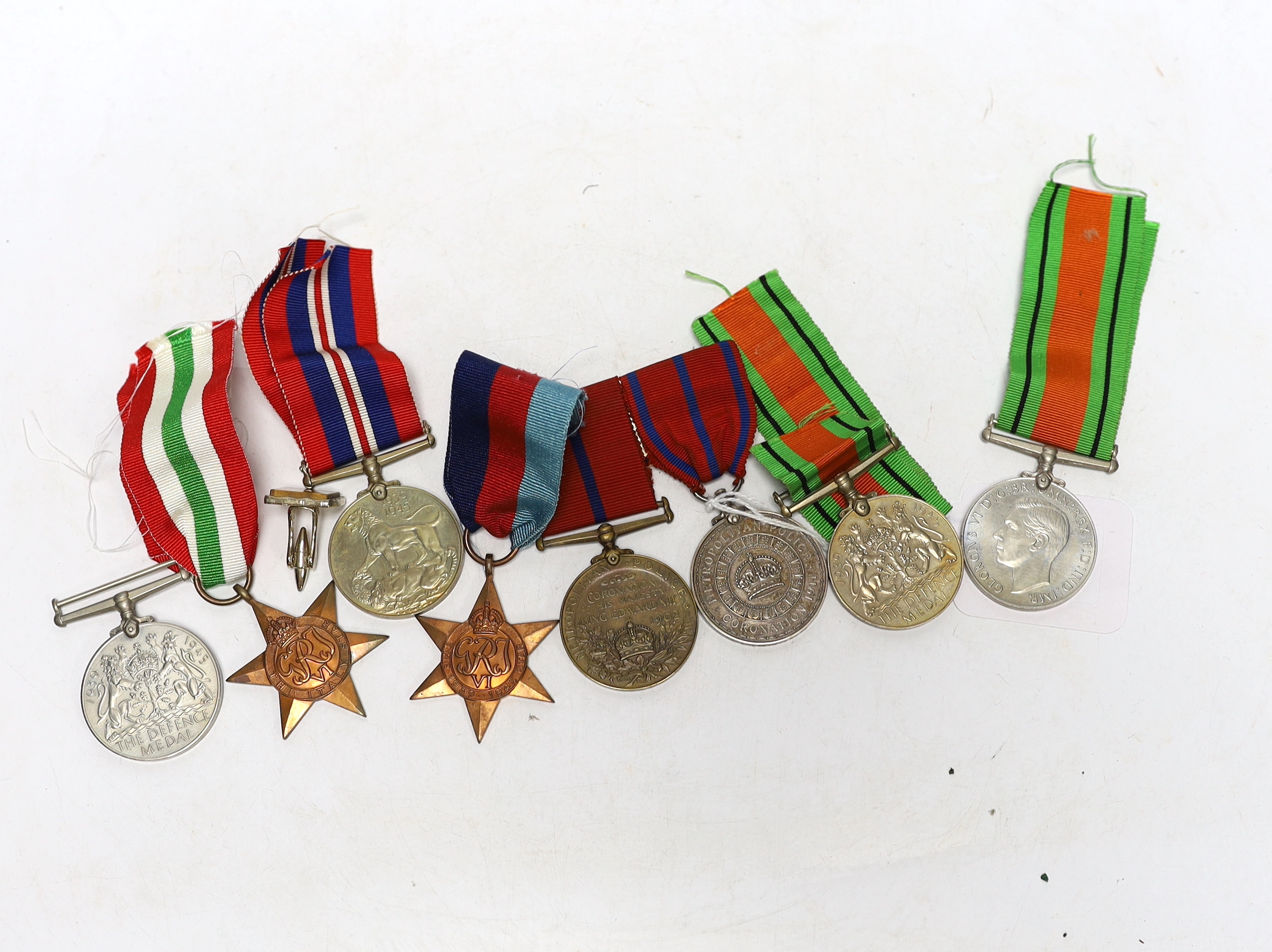 Group of assorted medals including; a pair of Metropolitan Police Coronation medals for 1902 and 1911 to P.S. A. Grunsell P. Div., together with six WWII medals; three Defence Medals, a War Medal, a 1939-45 Star and an I